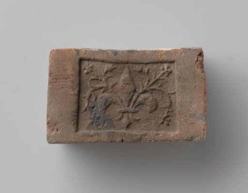 Fireplace with a Representation of a French Lily with Leafy Stems