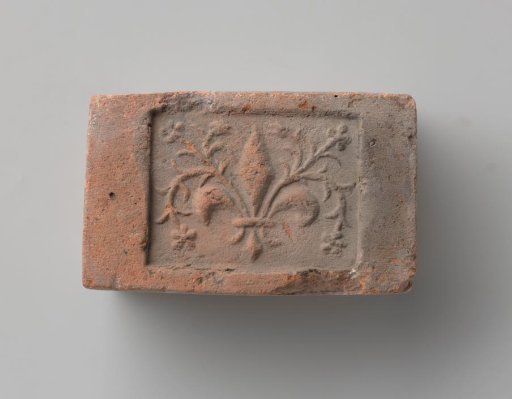 Fireplace with a Representation of a French Lily with Leafy Stems
