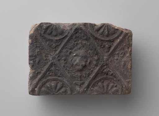 Fireplace with Lion's Head in a Profiled Diamond