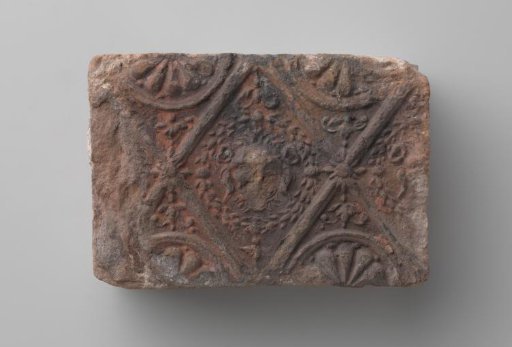 Fireplace with Lion's Head in a Profiled Diamond