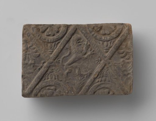 Fireplace with a climbing lion