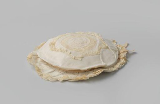 Children's hat with a low, broad crown, decorated with satin ribbon