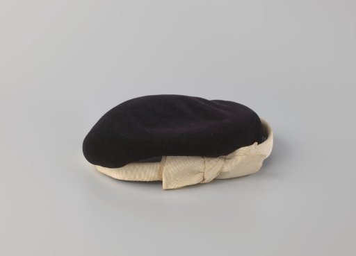 Cap (so-called bibi) of Black Velvet and Black Voile with a White Satin Bow