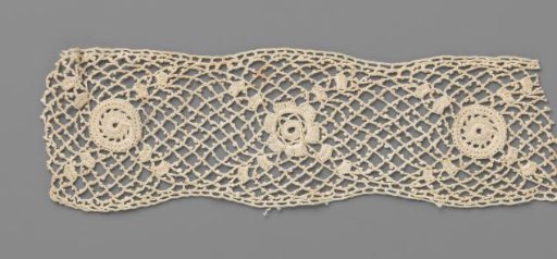 Strip of crocheted lace with rosette between two small circles
