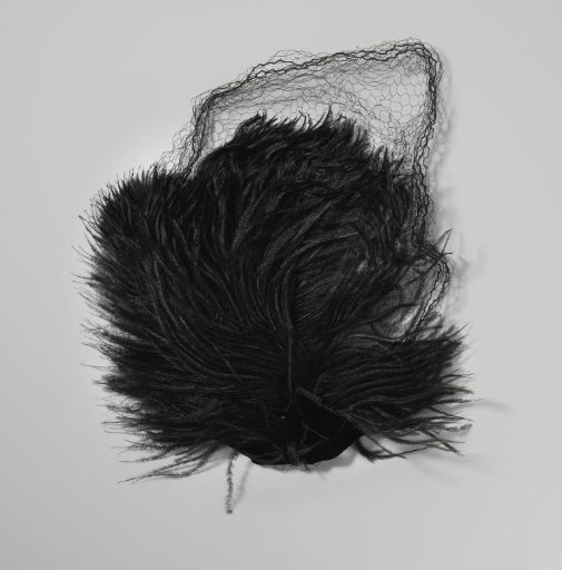 Tuft of ostrich feathers with veil and velvet bow, entirely black