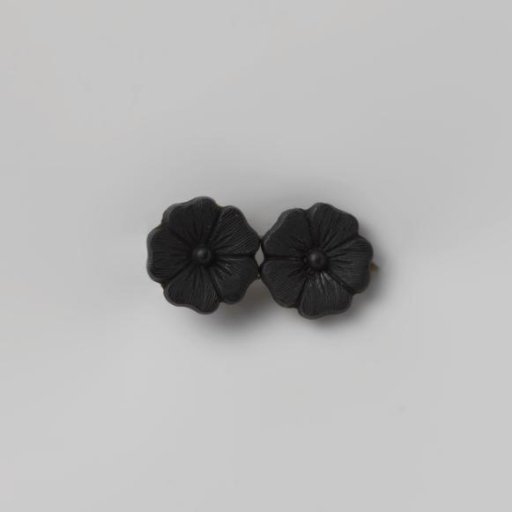 Mourning brooch with two flowers of black glass on silver brooch setting
