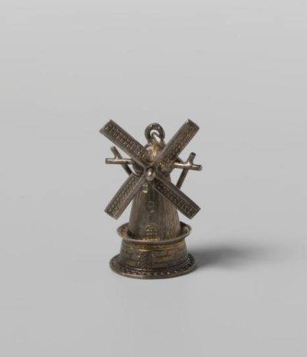 Silver charm of a mill