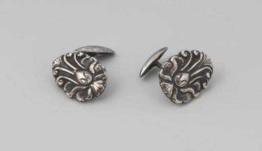 Pair of egg-shaped silver cuff buttons