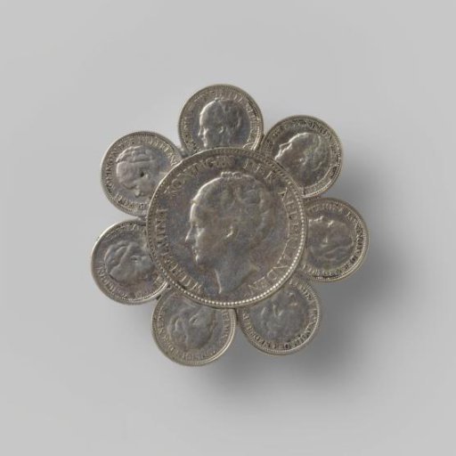 Silver coin brooch in the shape of a flower