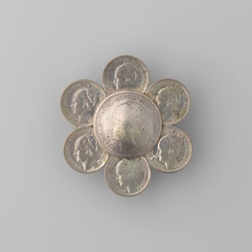 Silver coin brooch in the shape of a flower