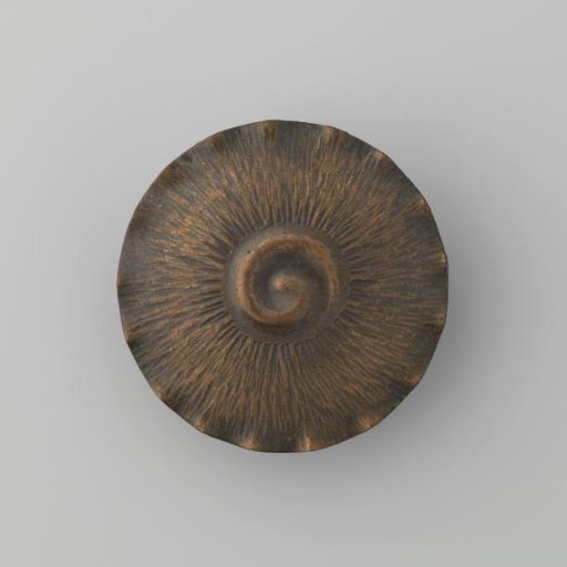 Round brooch of base metal with gold-colored finish