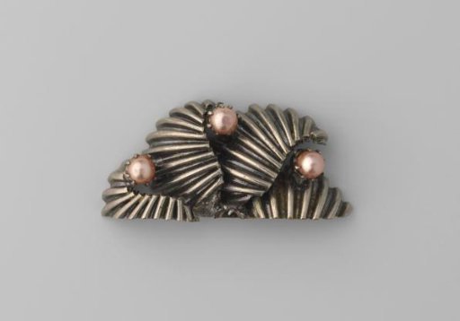 Half of a sawn wire brooch
