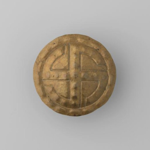 Round brooch of base metal with a cross-shaped relief