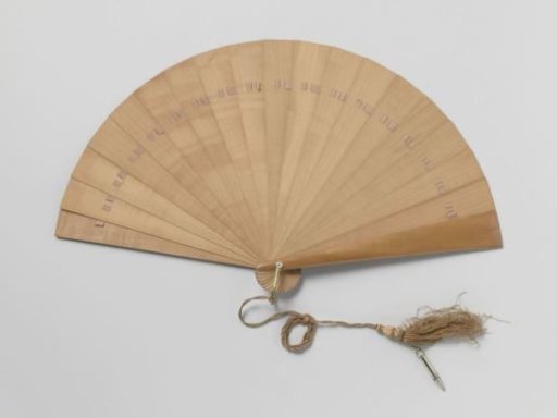 Fringed fan, to be used as a ball program, of wood with a copper fan ring to which a silk cord with a pencil in a nickel holder is attached