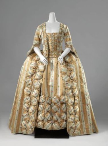 Japanese robe à la française of silk with vertical yellow and white stripes and a straw motif of multicolored bouquets, adorned with oval pouffes and lined with multicolored ikat
