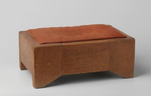 Footstool upholstered in red wool