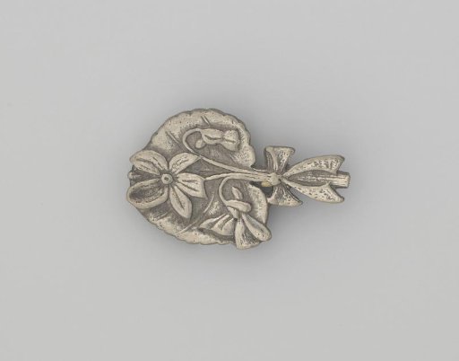 Tin brooch with flowers and bow