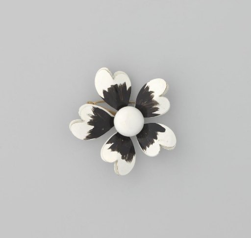 Brooch in the shape of a flower in black and white enameled metal
