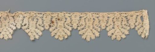 Strip of bobbin lace with thistle in flowerpot