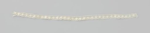 Fragment of bobbin lace for a mantelpiece