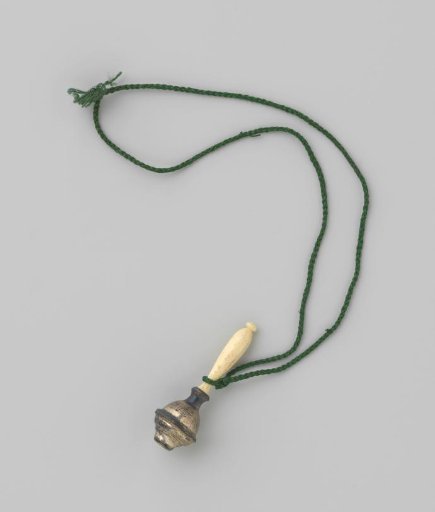 Rattle of silver with handle of white ivory and green cord