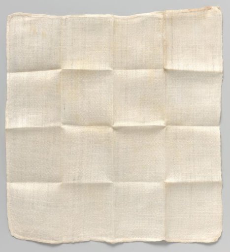 White napkin with woven check pattern