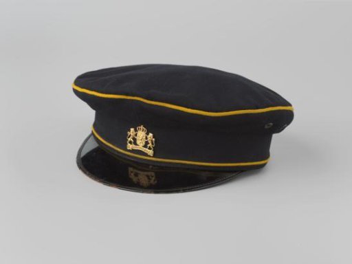 Black cap with an emblem of gold-colored metal