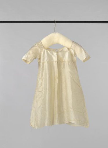 Plain white children's dress of silk with short sleeves