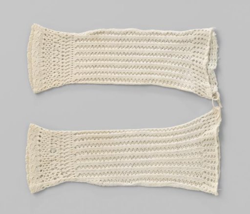White knitted child's sleeve with openwork