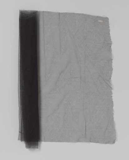 Coupon of rolled dark blue tulle