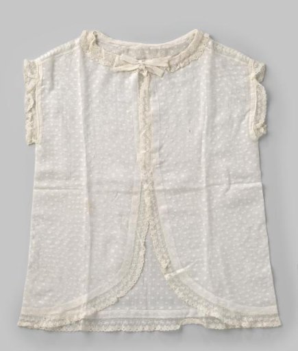Shirt of white cotton batiste with ruffles and strips of Valenciennes lace
