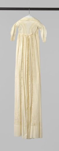 White baptismal gown with white embroidery and ruffles