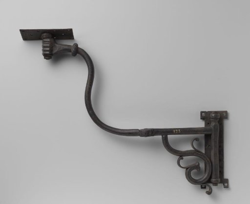 Arm of a hanging sign in the shape of a hand