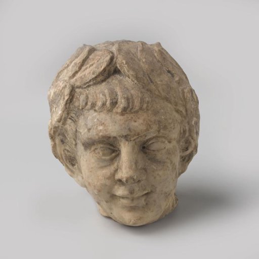 Emperor's head of white marble, fragment of garden sculpture.