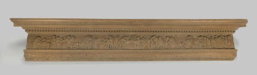 Headpiece of an oak fireplace mantel