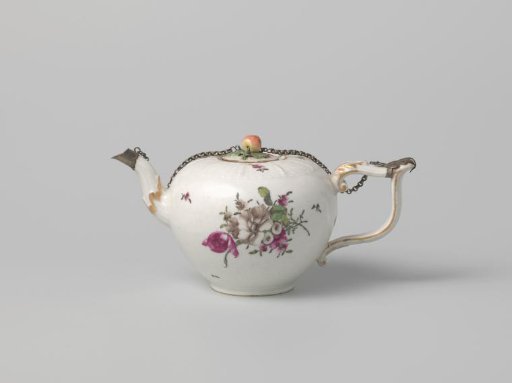 Teapot with bouquets and flowers