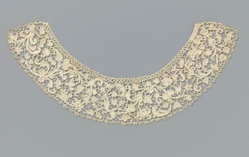 Collar of needle lace with various flowers and curling leaves on vines