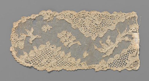Cap edge (fragment) of needle lace with wheel picots in triangular fields and a lily of the valley in the wavy central field