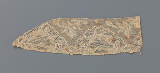 Strip of bobbin lace with triangular field with branching twig