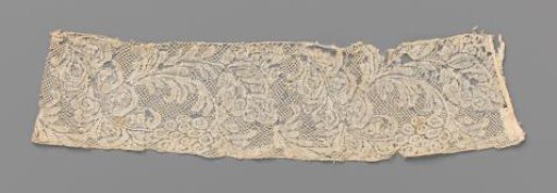Strip or cuff of bobbin lace with a large diagonal leaf and a cluster of oval flowers or berries