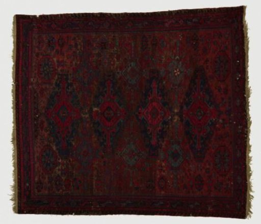 Woolen carpet with geometric figures