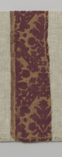 Fragment of red ciselé velvet with a yellow ground and a pattern of palmettes