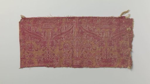 Fragment of red and yellow brocatelle with stylized floral motifs
