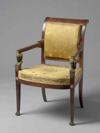 Armchair of mahogany with a yellow silk upholstery