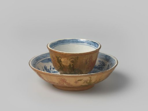 Cup and saucer of faience and straw with floral decoration