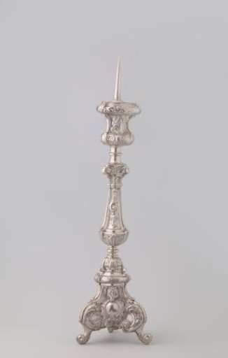 Altar candlestick of silver, baluster-shaped, on three volute-shaped feet. Decorated with leaf motifs and rocailles.