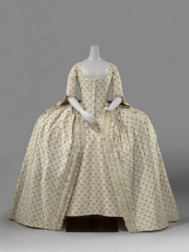 Skirt, partly of cream-colored silk, partly of cream-colored silk with embroidered pink stripes and multicolored flowers with white cream-colored bows.