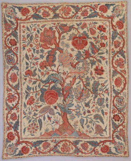 A bedspread of sateen with a tree motif on a white ground