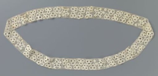 Strip of crocheted lace with five-pointed stars and flowers made with open circles