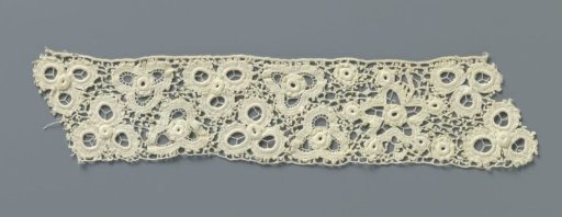 Strip of crocheted lace with five-pointed stars and flowers made with open circles